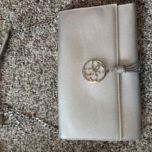 Like new Guess clutch, cross body capable.